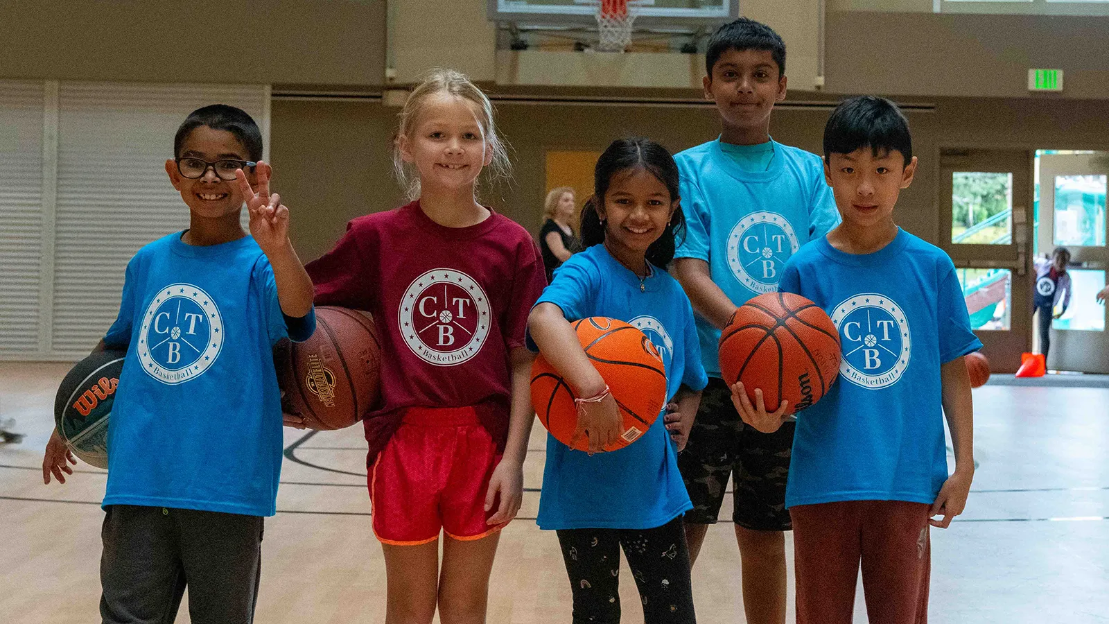 Young kids playing competitive basketball
